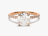 Rose gold oval diamond engagement ring with pave band