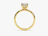 Emerald cut diamond ring in yellow gold setting