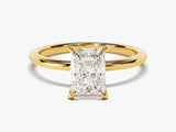 Radiant cut diamond engagement ring in yellow gold band