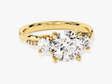 Gold three-stone diamond engagement ring with twisted band