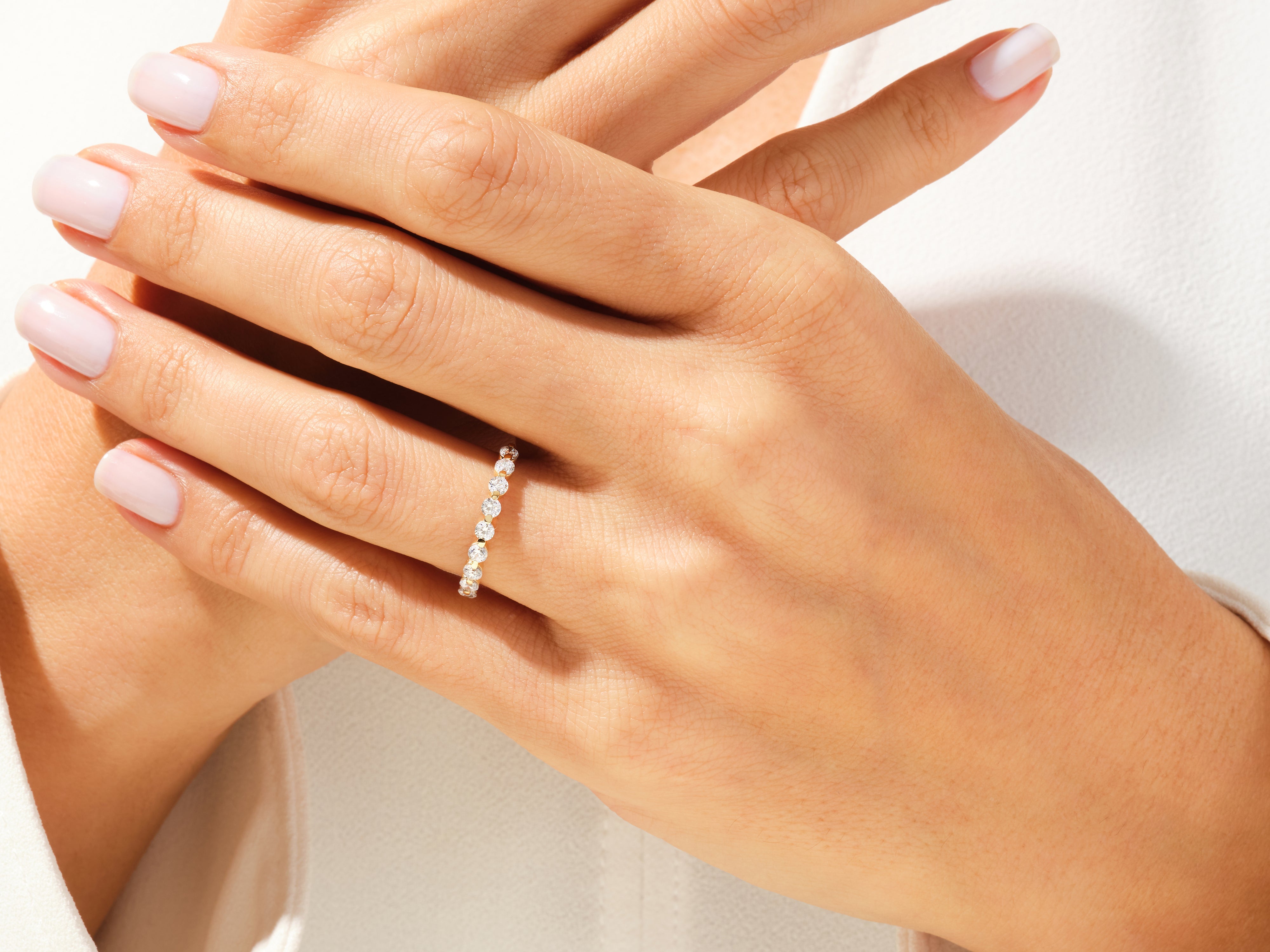 Diamond eternity ring on a woman's hand