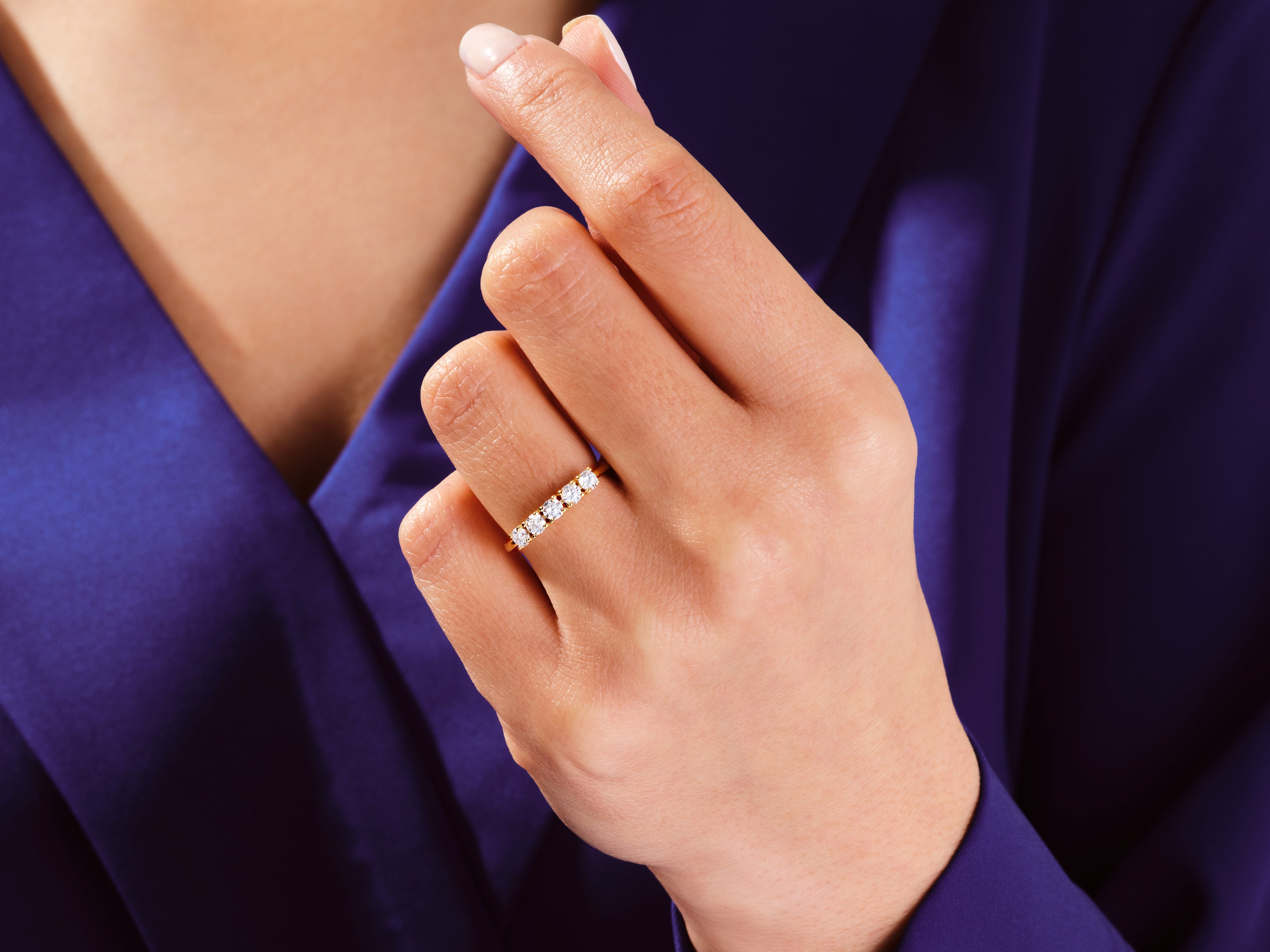 Diamond band ring on a hand, jewelry product photography
