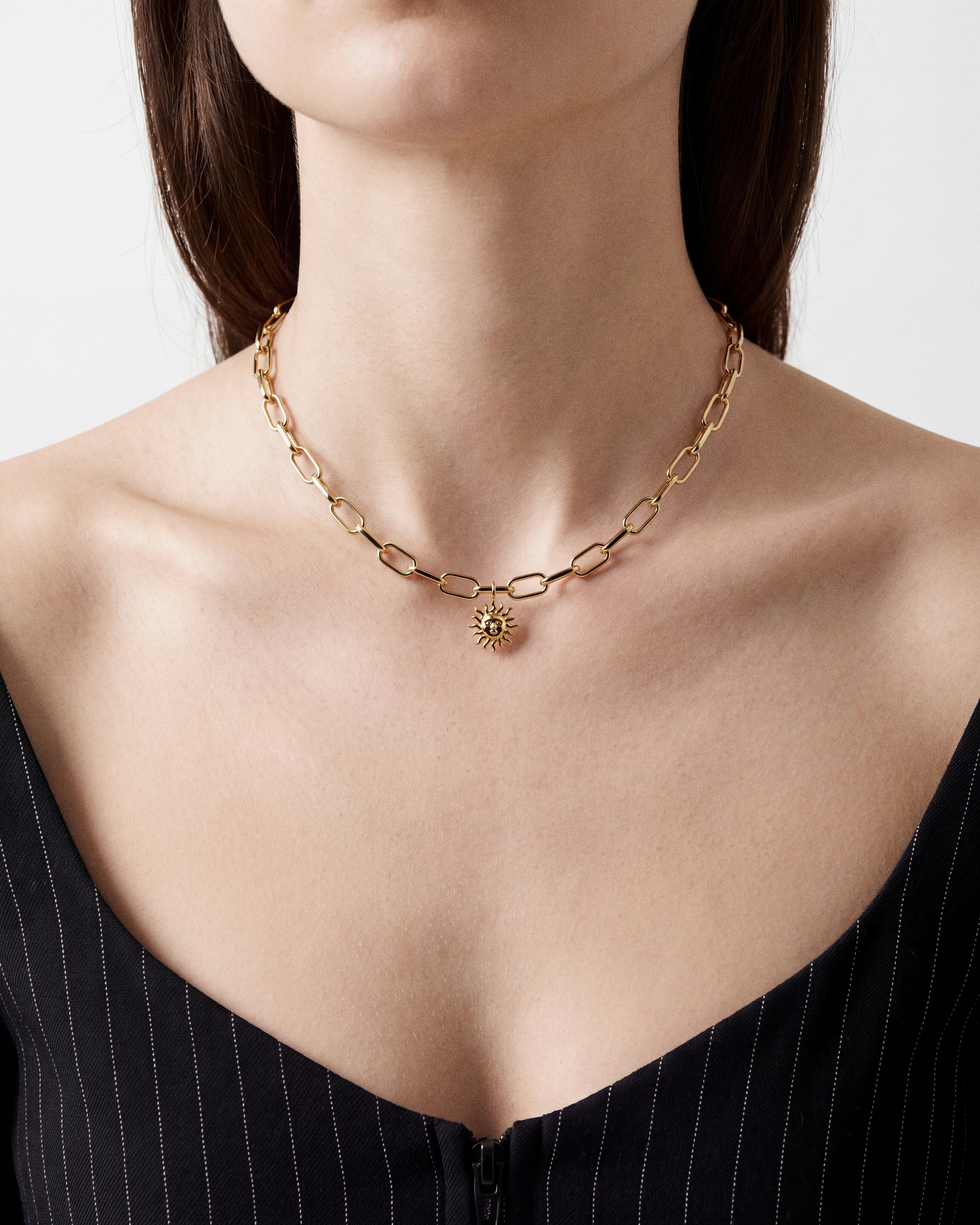 Sunface Charm worn by a model