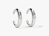 Sleek silver hoop earrings from a jewelry brand