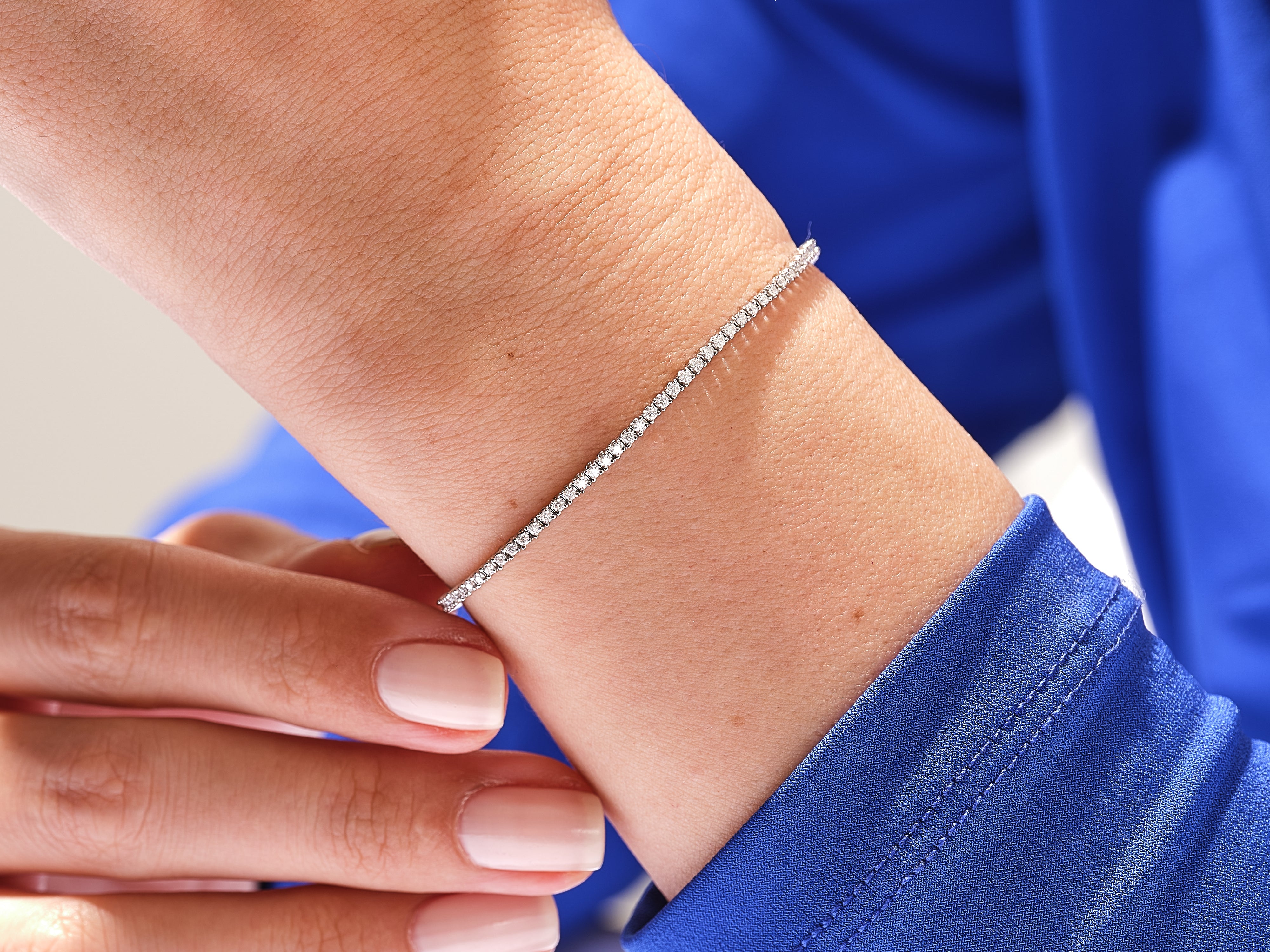 Diamond tennis bracelet on wrist, fine jewelry for women