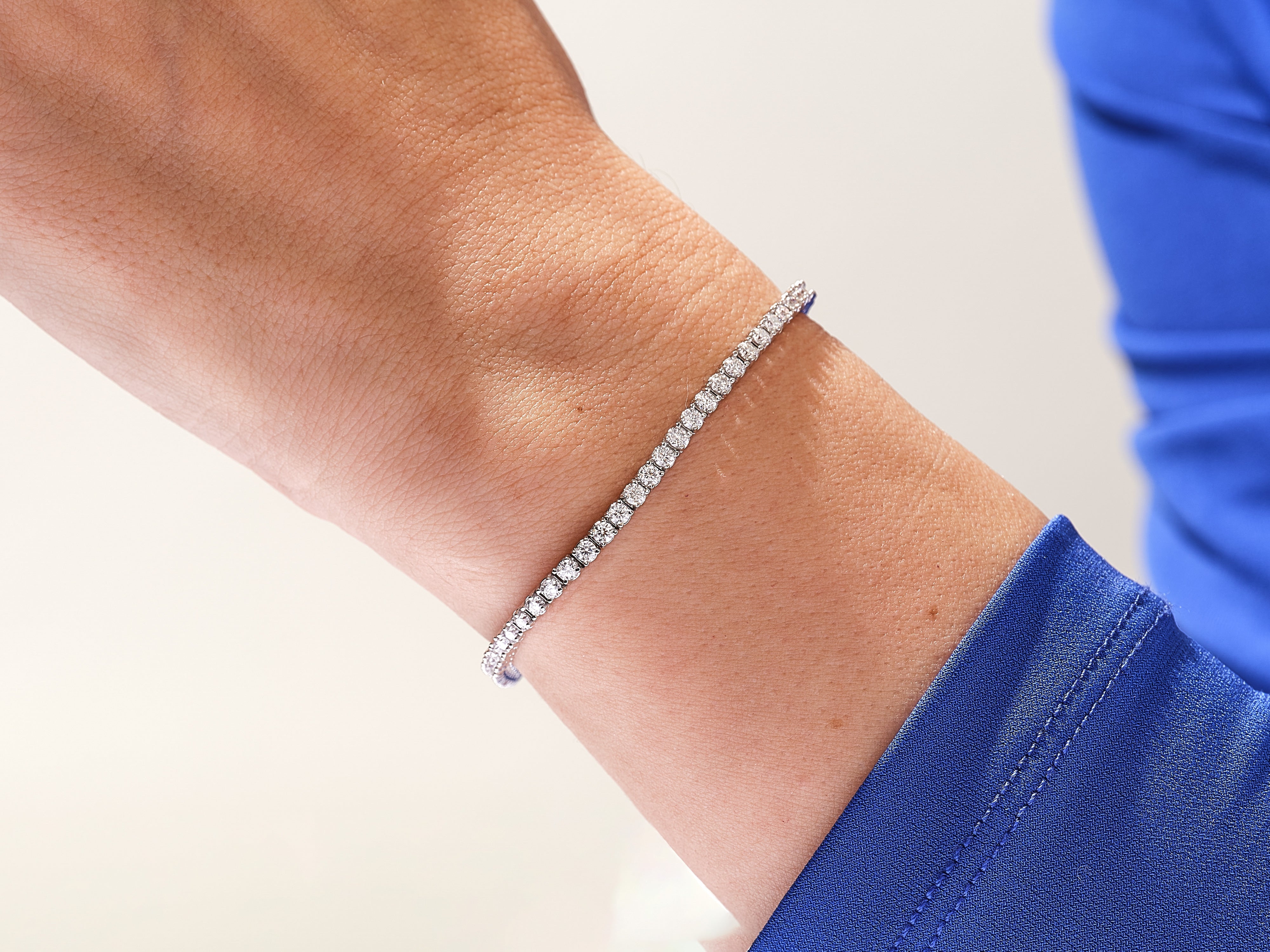 Diamond tennis bracelet on a wrist, jewelry for women