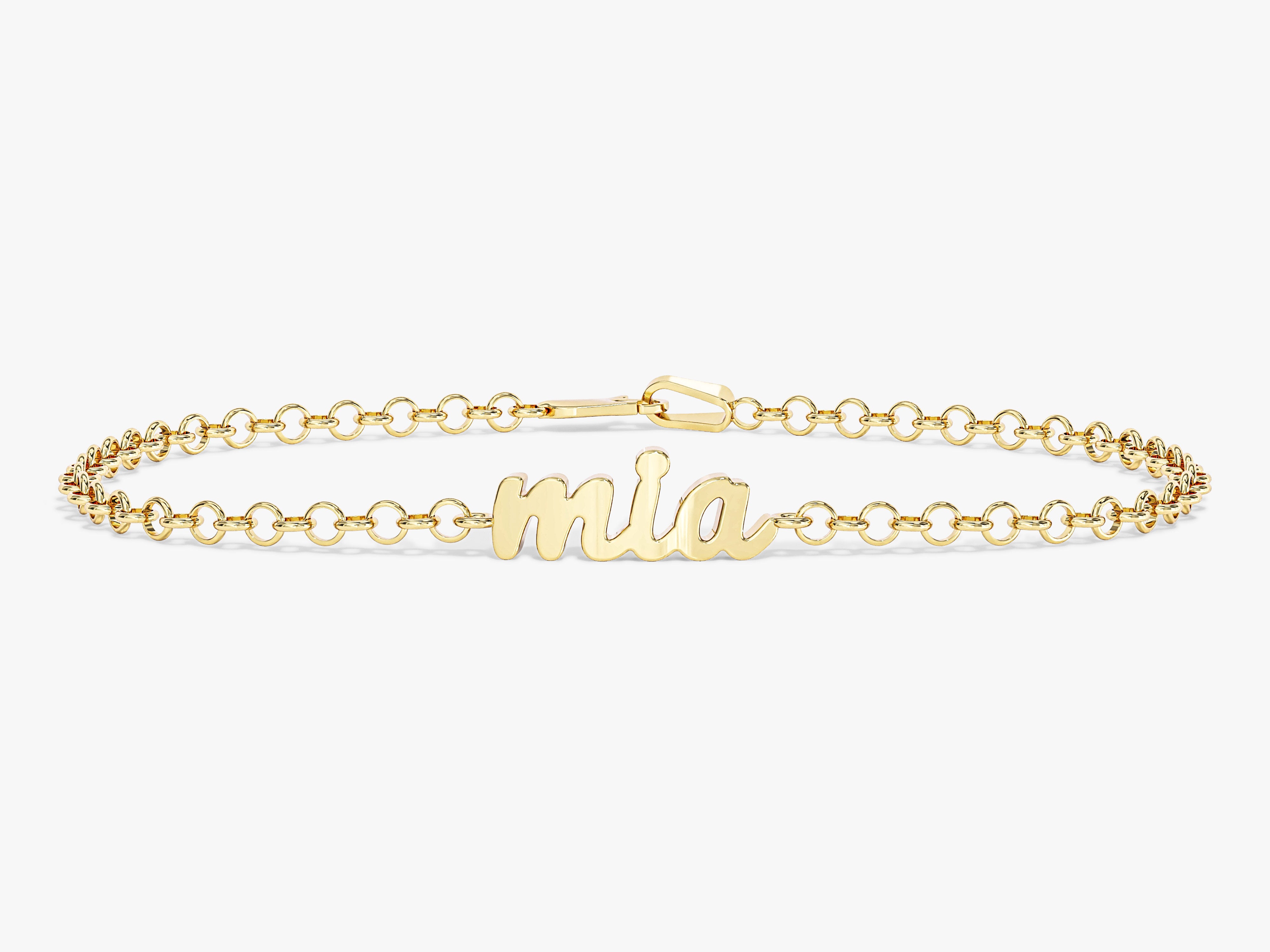 Gold name bracelet with "mia" script charm