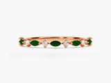 Rose gold ring with marquise emeralds and diamonds
