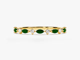 Gold ring with alternating emerald and diamond gemstones