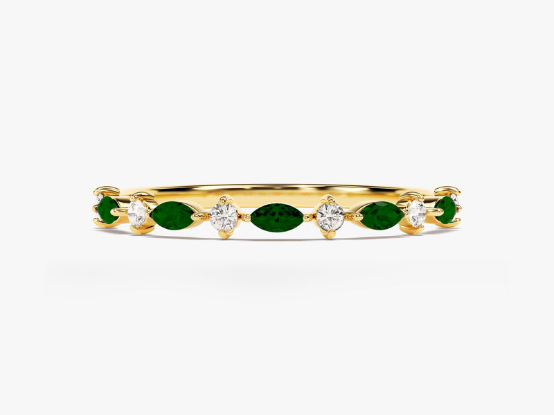Gold ring with alternating emerald and diamond gemstones