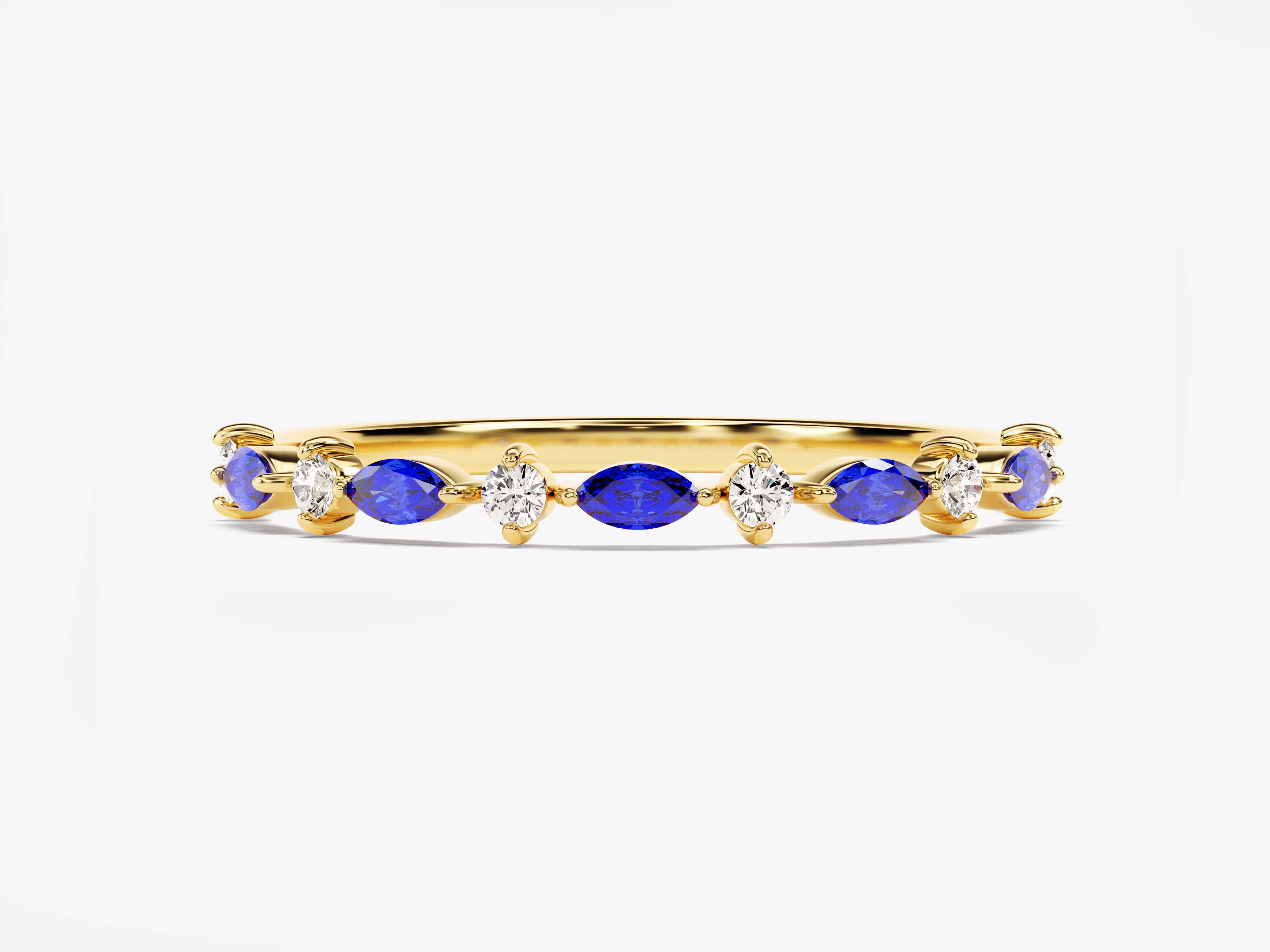 Gold ring with alternating blue sapphires and diamonds
