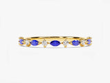 Gold ring with alternating blue sapphires and diamonds