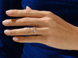 Gold rings with colorful gemstones on a hand