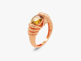 Rose gold ring with oval yellow gemstone, unique jewelry design