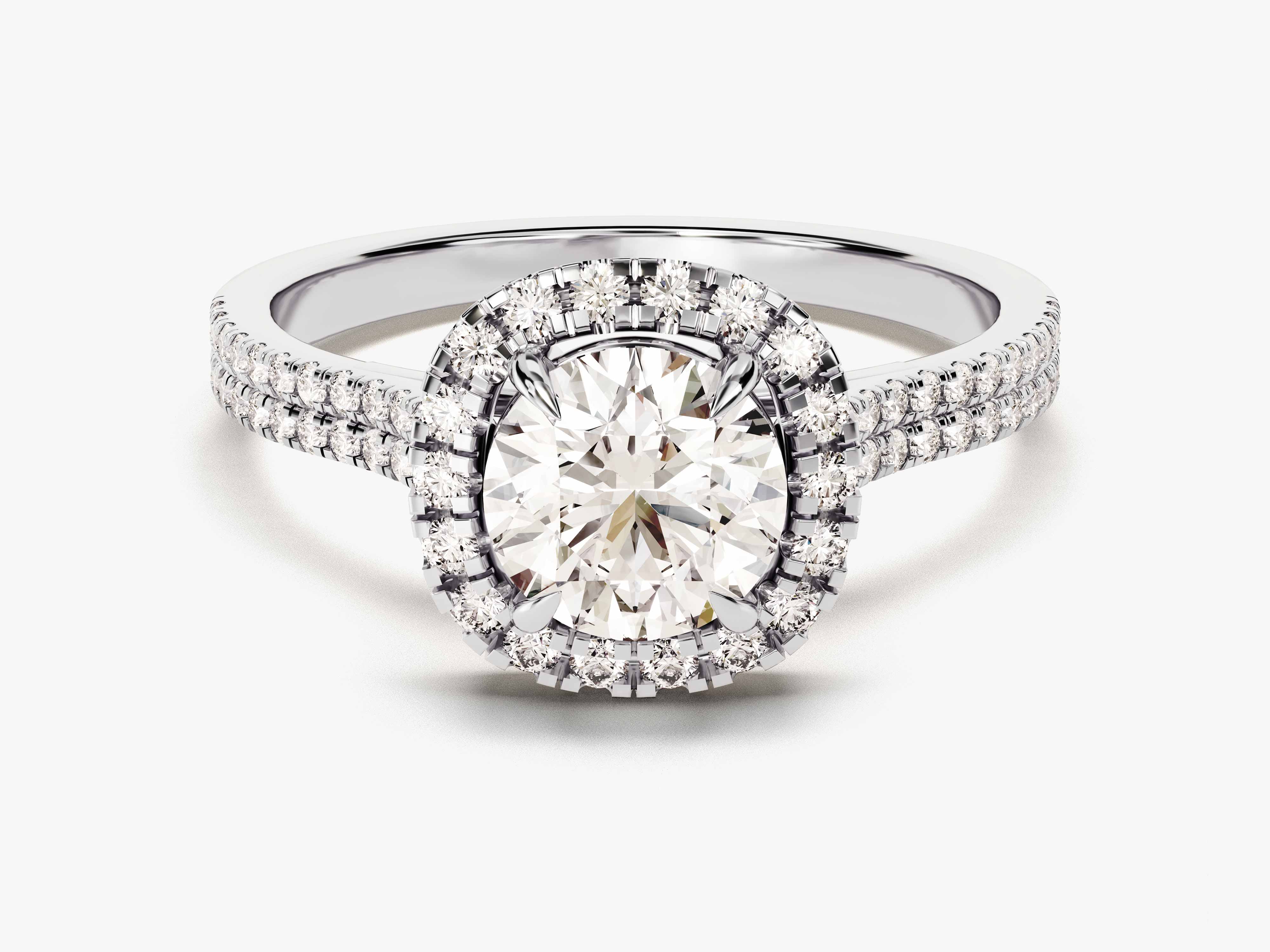 Oval diamond engagement ring with double halo and diamond band
