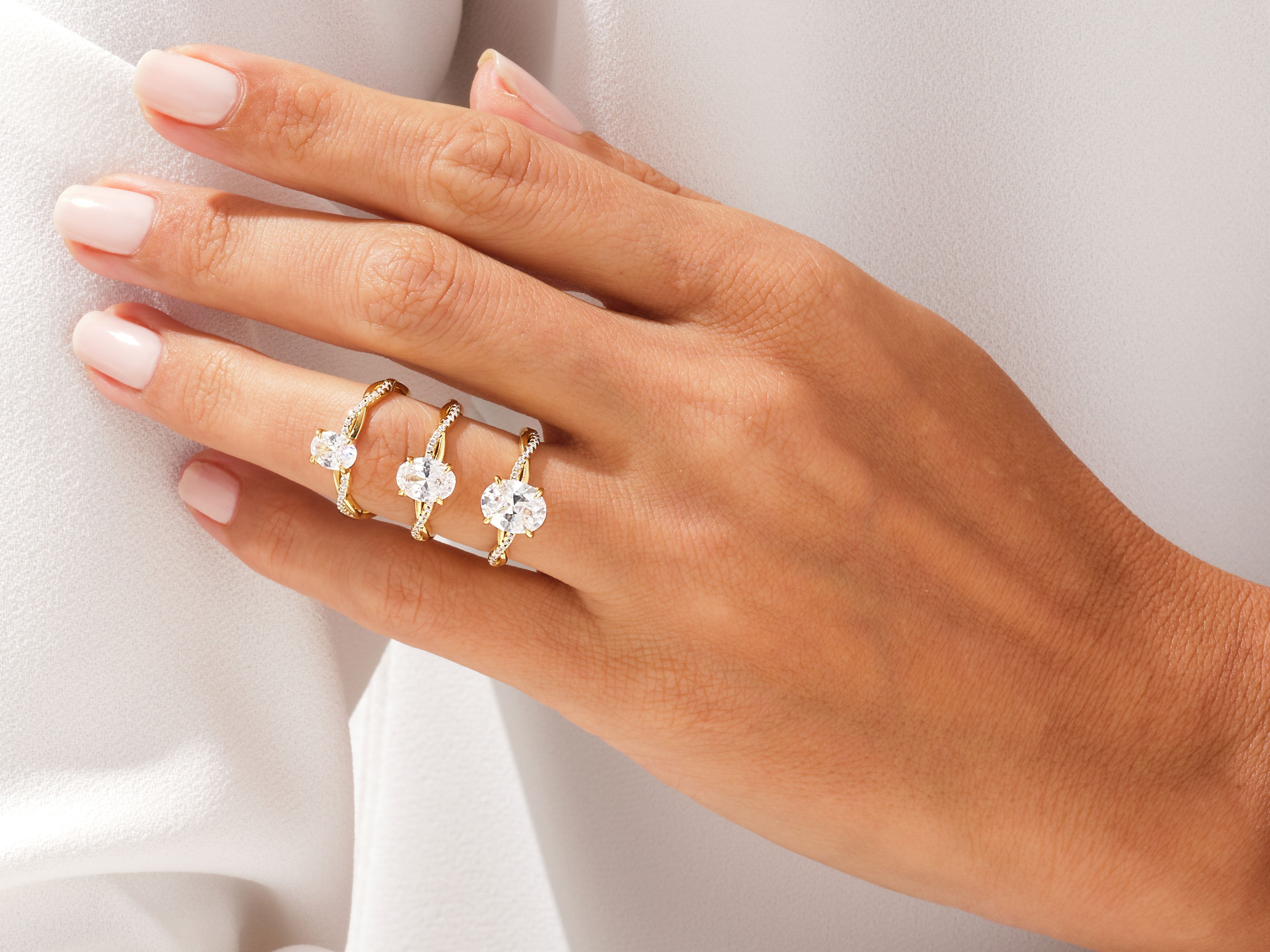 Oval Twisted Moissanite Engagement Ring with Pave Set Side Stones (1.50 CT)