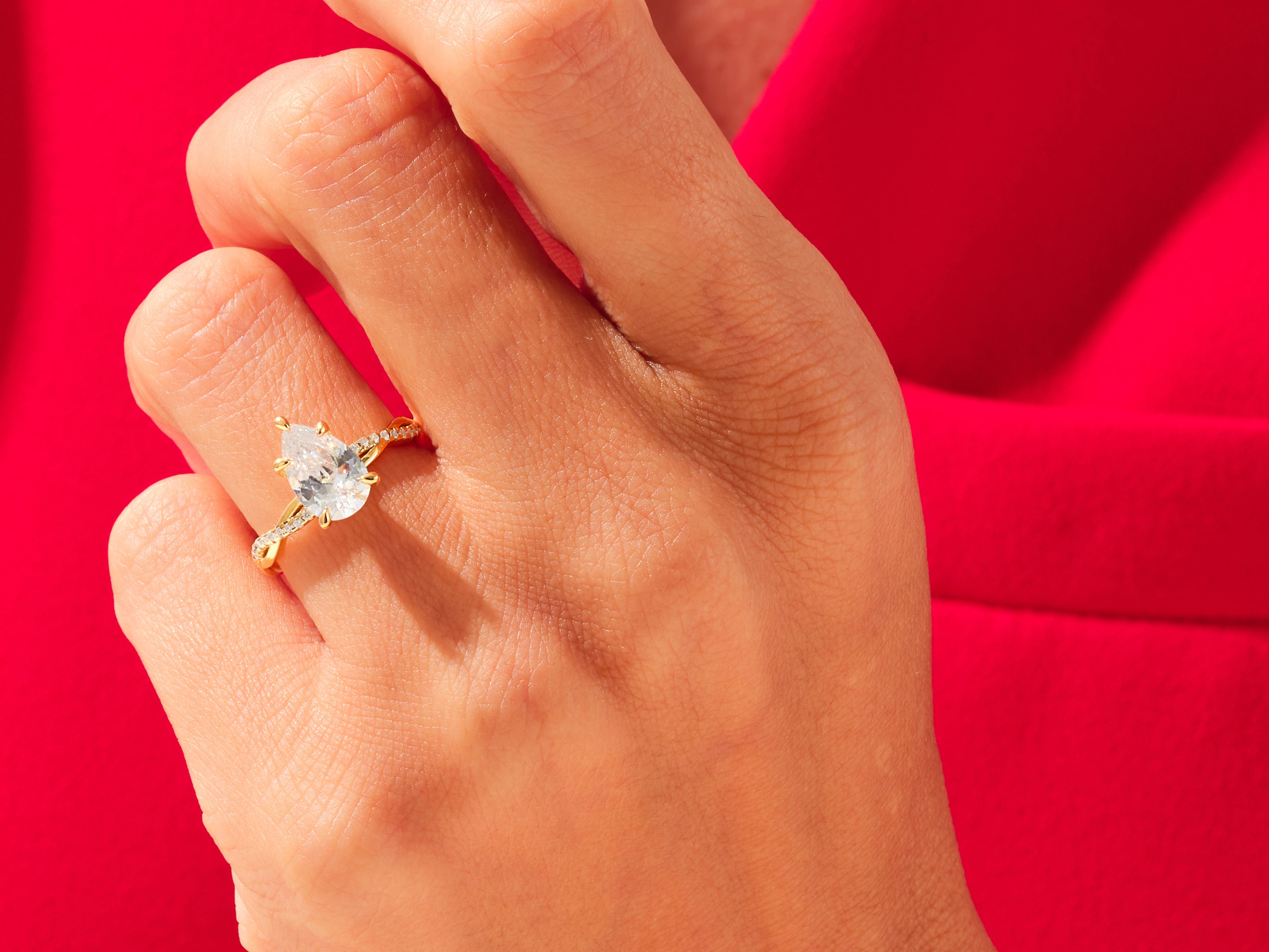 Pear Twisted Diamond Engagement Ring with Pave Set Side Stones (3.00 CT)