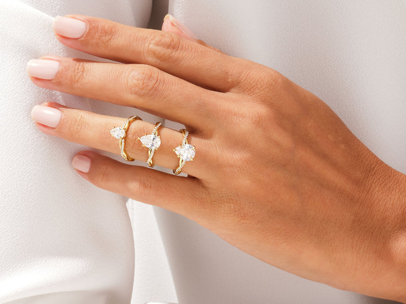 Pear Twisted Moissanite Engagement Ring with Pave Set Side Stones (2.00 CT)