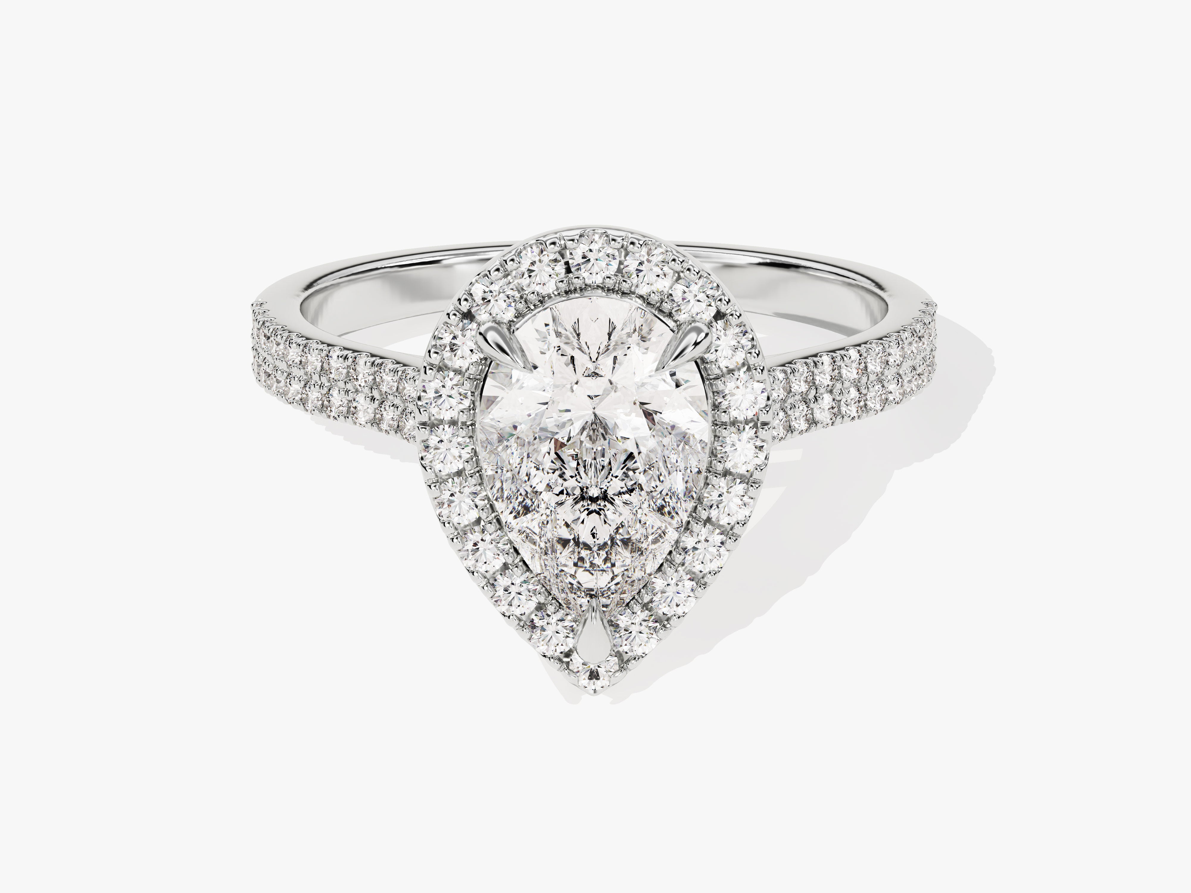 Diamond halo engagement ring with pear-shaped center stone