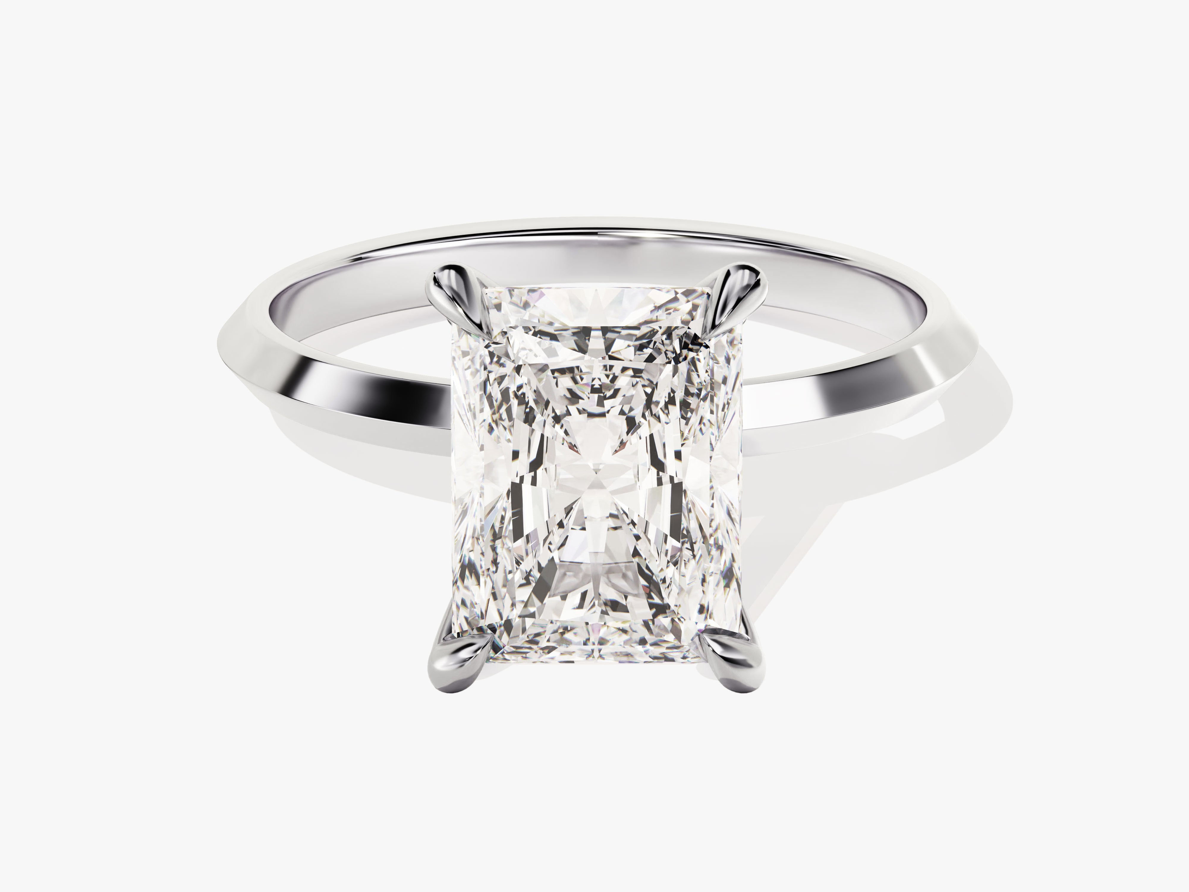 Radiant cut diamond engagement ring on white background