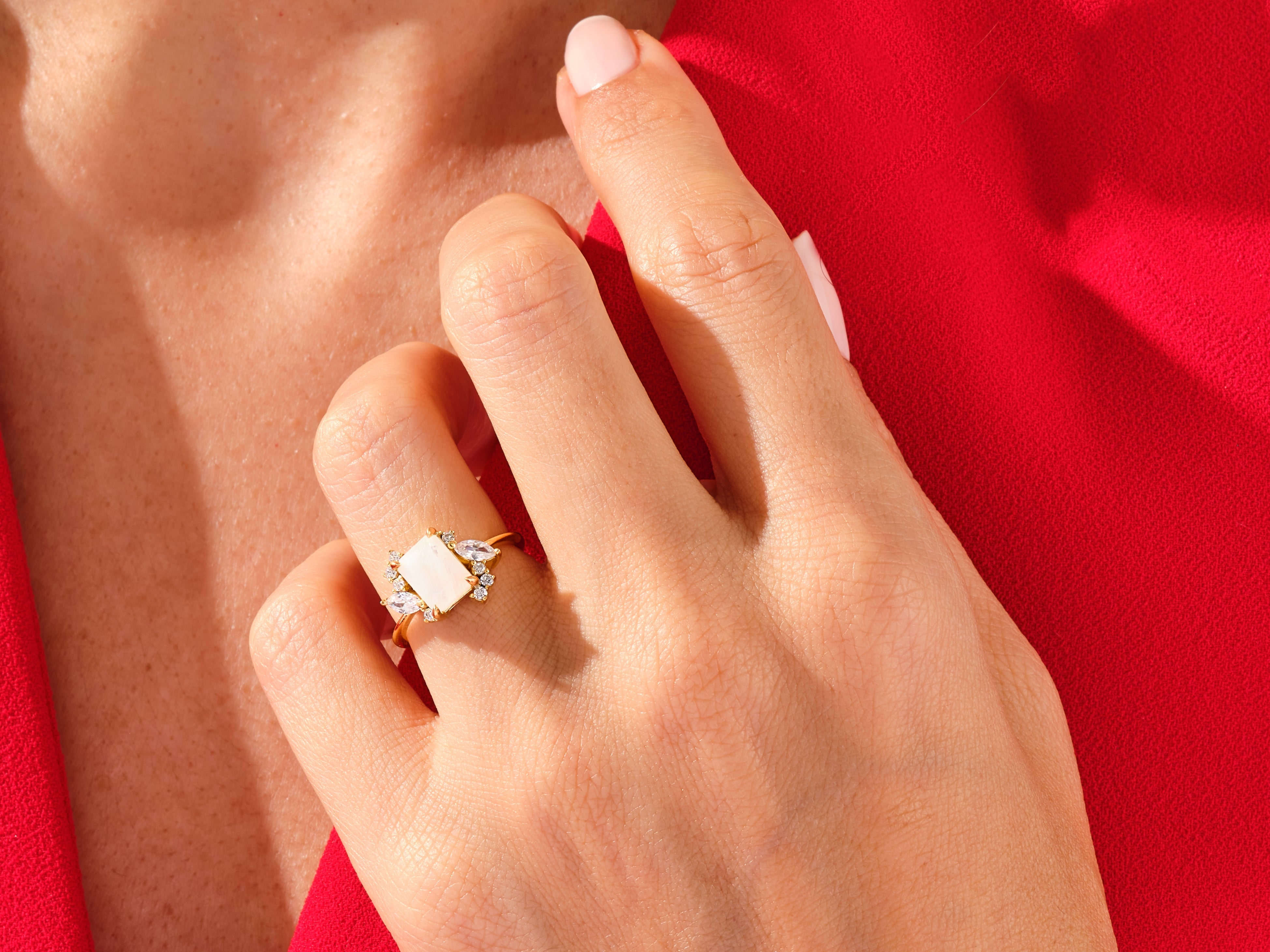 Emerald Cut Moonstone Engagement Ring with Marquise and Round Moissanite Sidestones