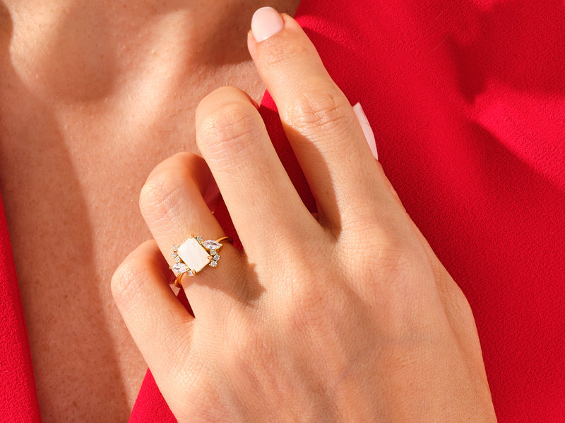 Emerald Cut Moonstone Engagement Ring with Marquise and Round Moissanite Sidestones