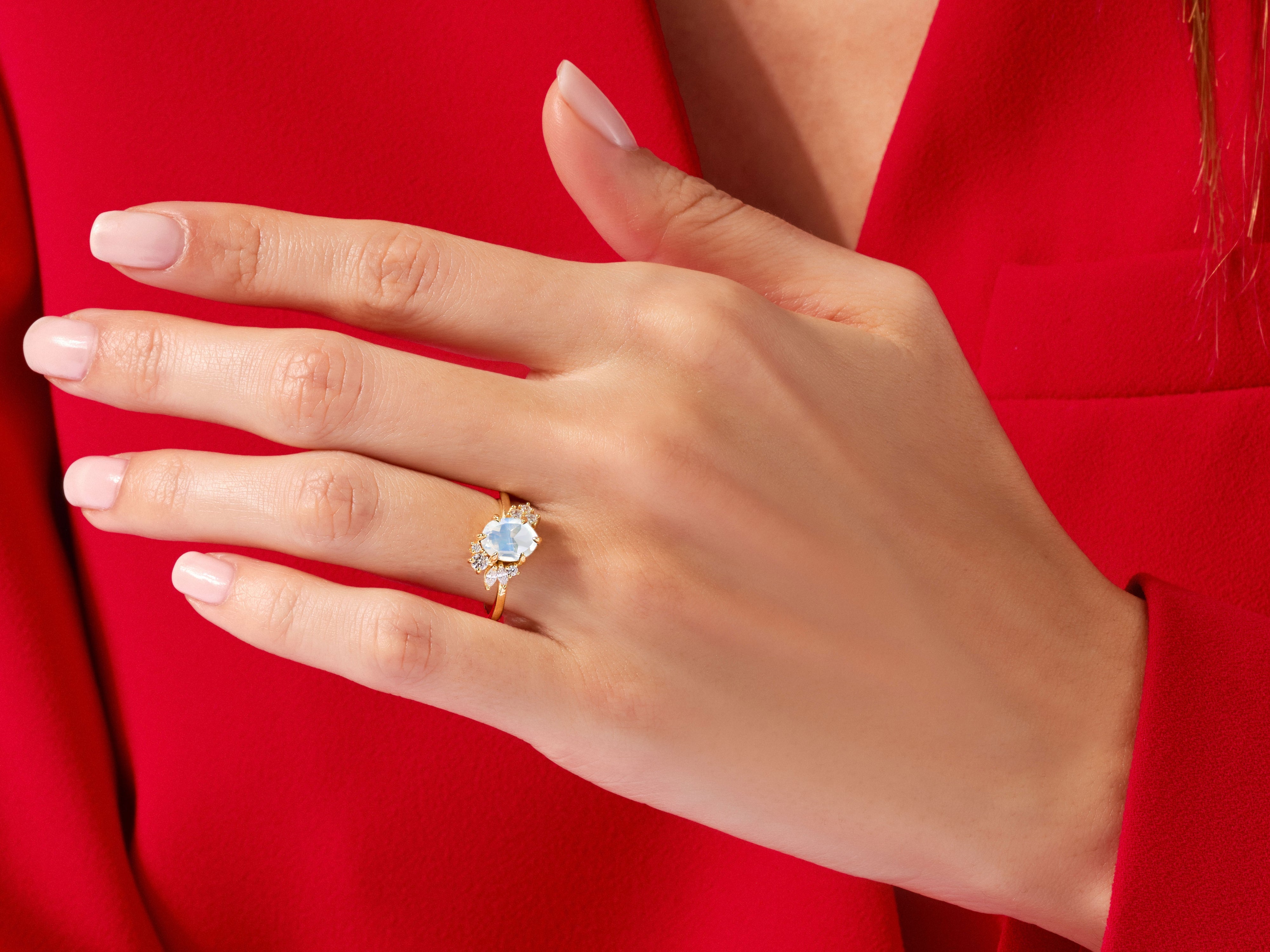 Oval Moonstone Engagement Ring with Round Moissanite Cluster