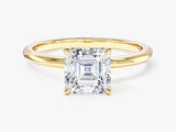 Asscher cut diamond engagement ring in yellow gold