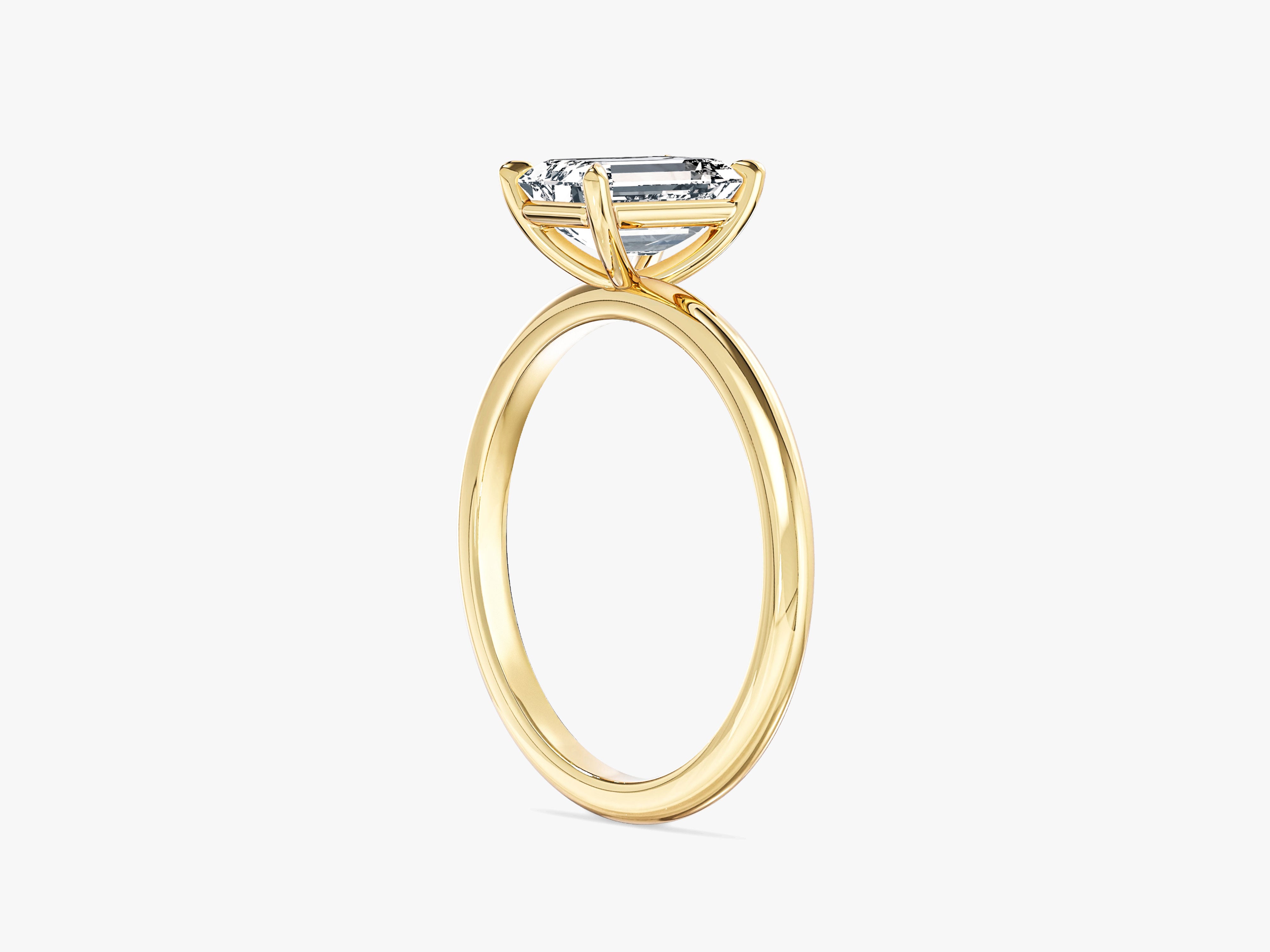 Emerald cut diamond engagement ring in yellow gold