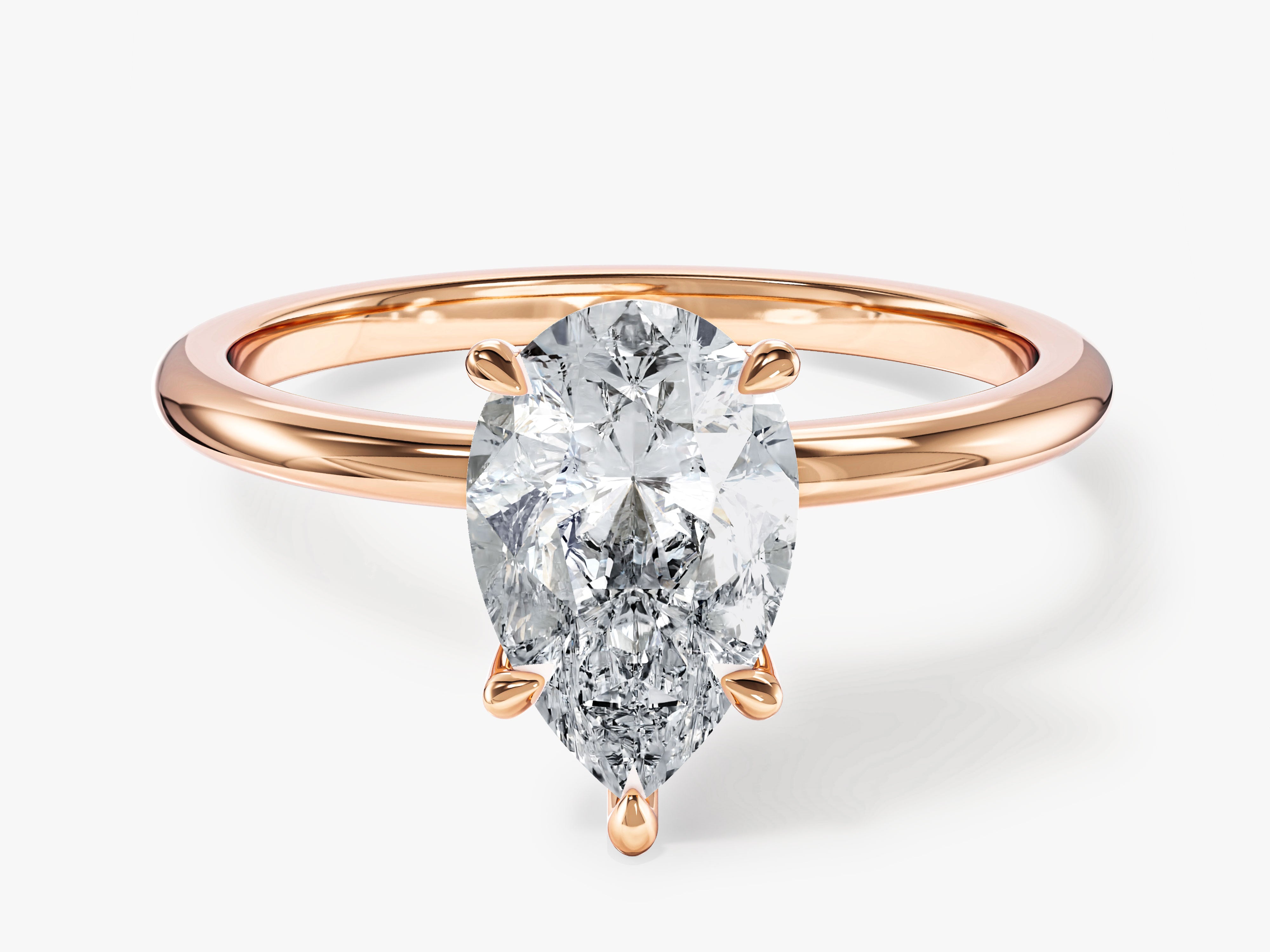 Rose gold pear cut diamond engagement ring