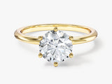 Gold engagement ring with a sparkling diamond center stone