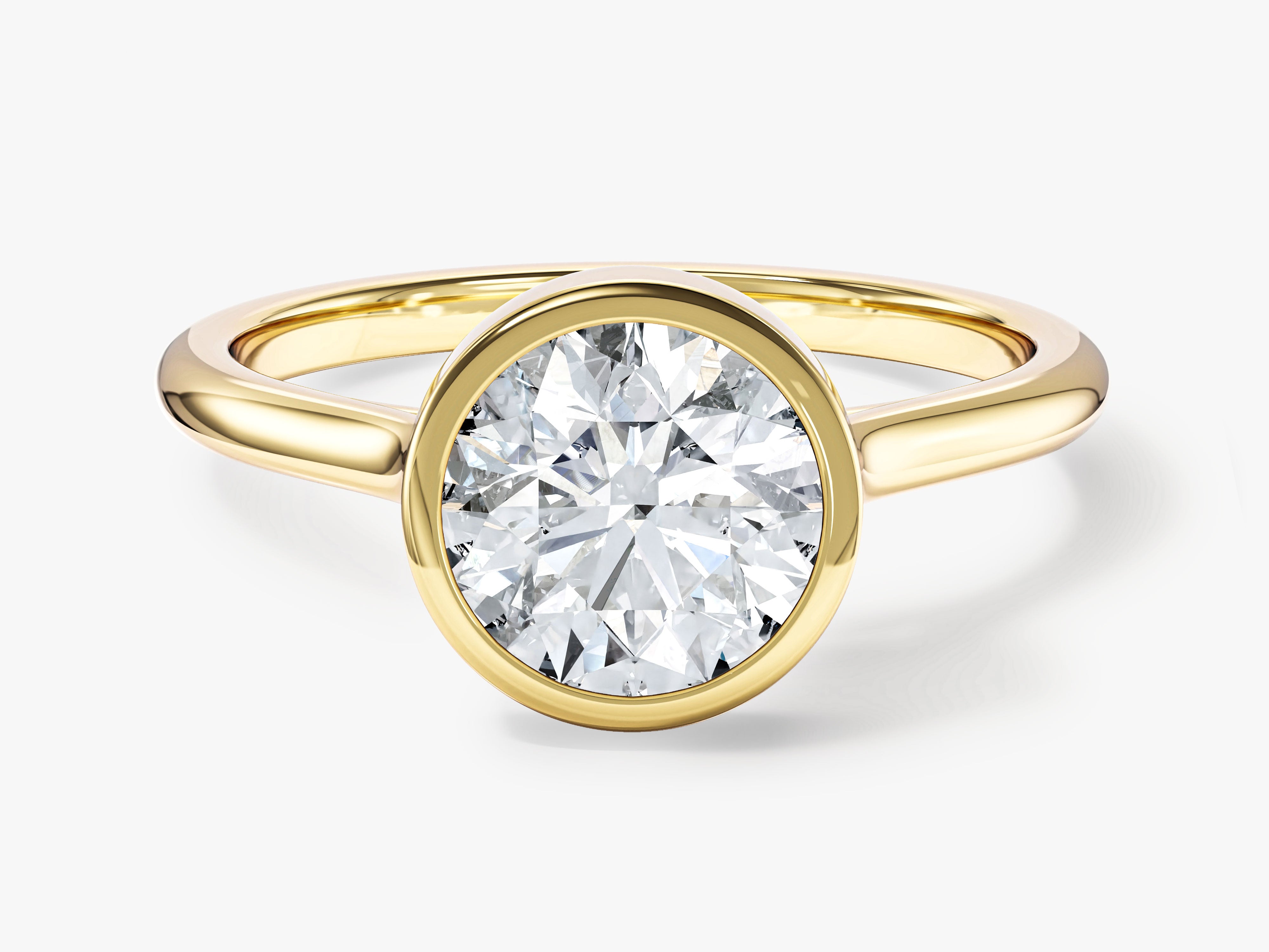 Gold bezel set diamond engagement ring from jewelry company