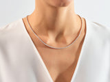 Diamond tennis necklace on a woman's neck