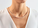 Diamond tennis necklace on a woman's neck, fine jewelry