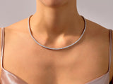 Diamond tennis necklace on a woman's neck, fine jewelry