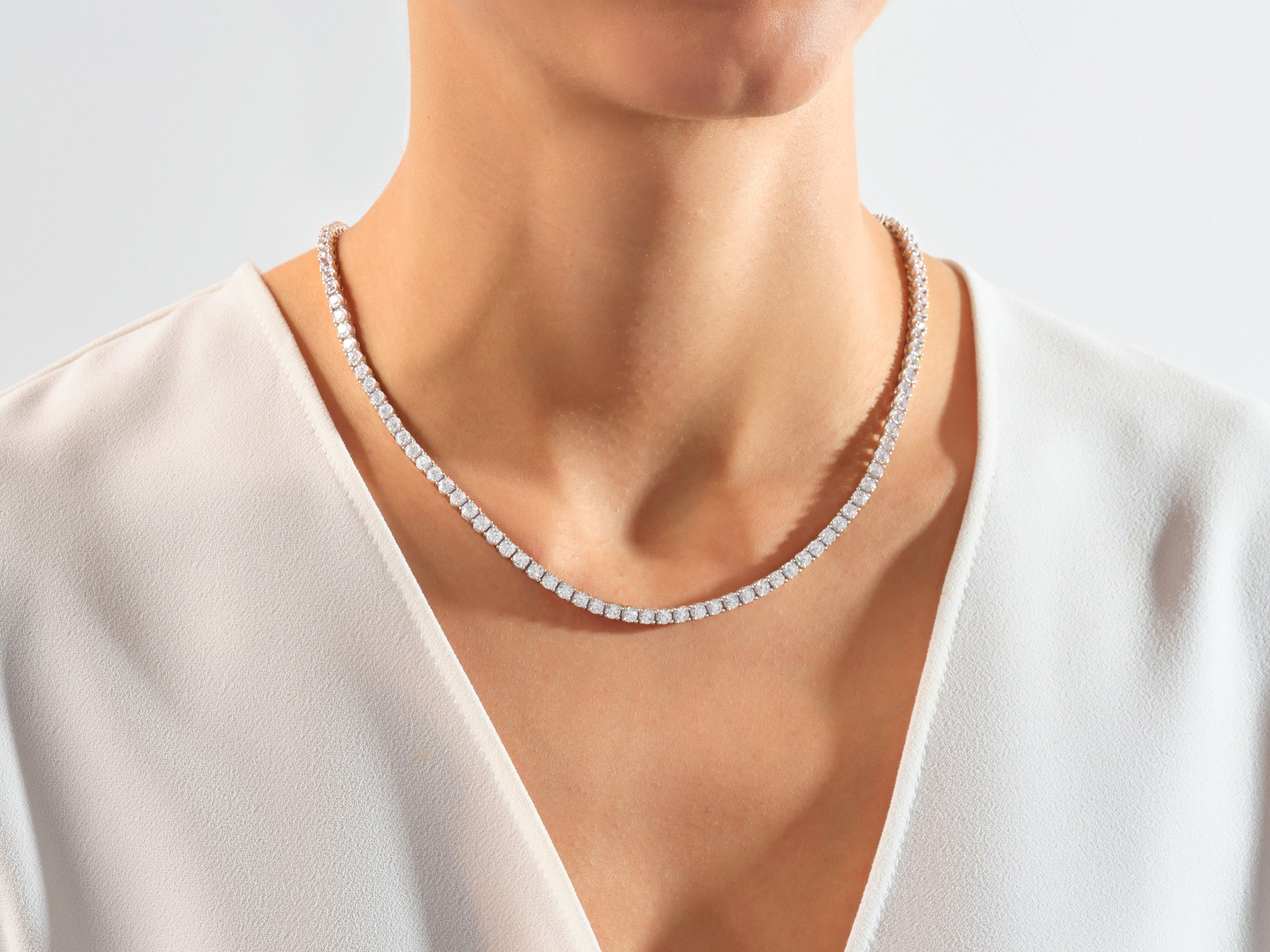 Diamond tennis necklace on a woman's neck