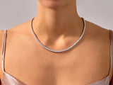 Diamond tennis necklace on a woman's neck, fine jewelry