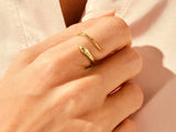 Gold snake ring on finger, elegant jewelry for women