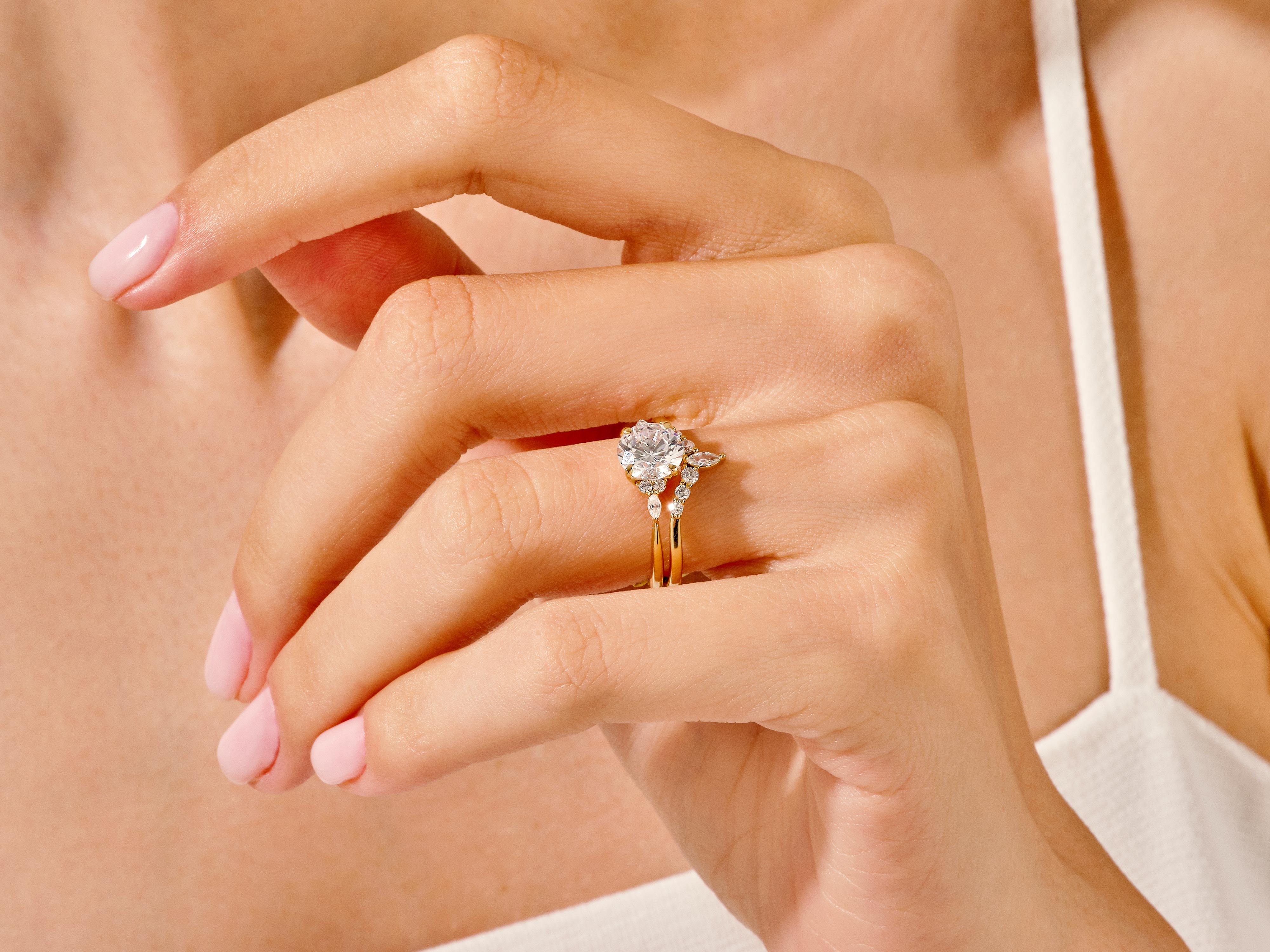 Diamond engagement ring set on a woman's hand