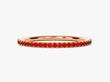 Rose gold eternity band with red gemstones jewelry