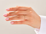 Diamond eternity band on a hand, jewelry product photography