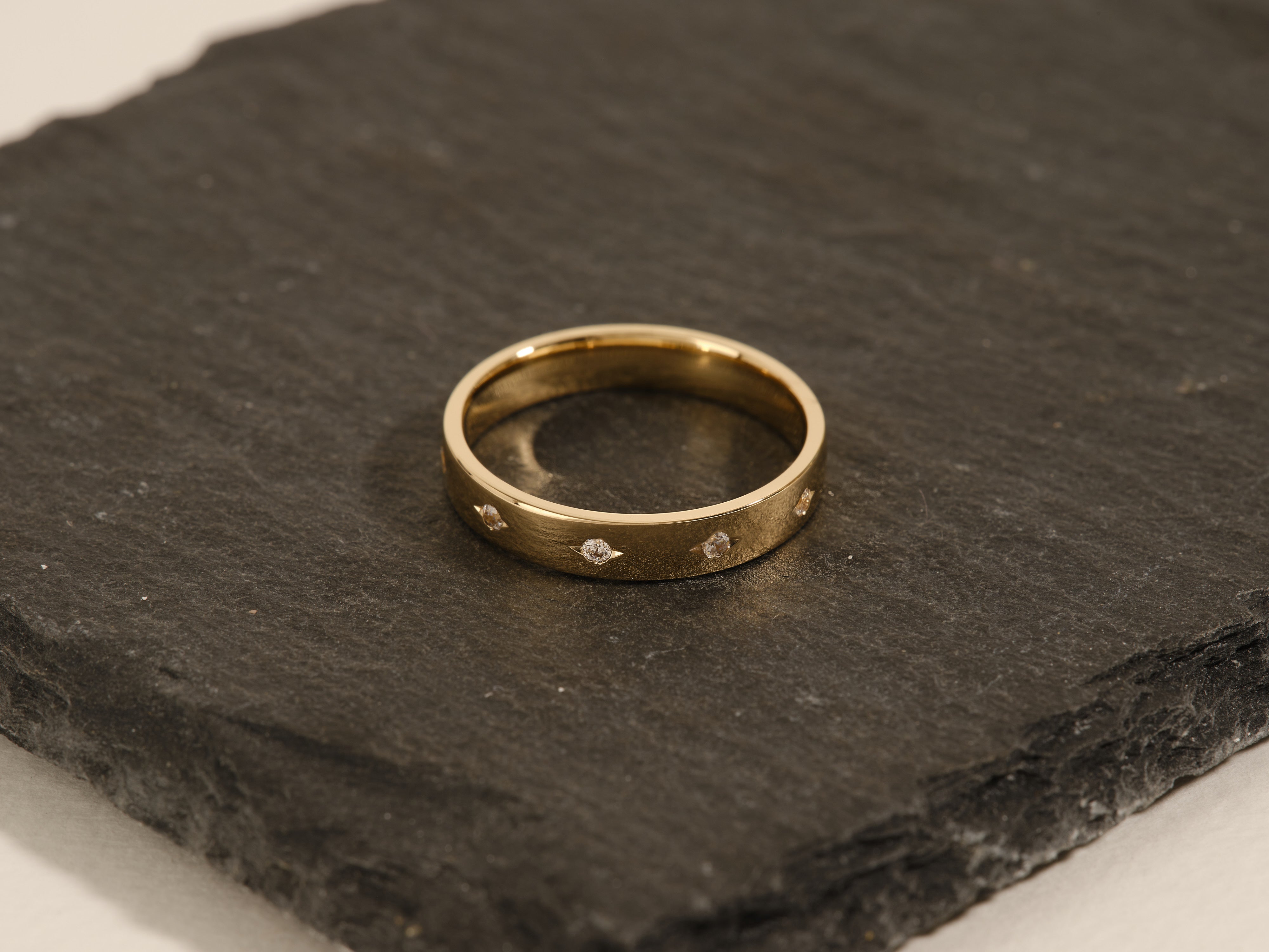 Gold ring with diamonds on slate, jewelry for sale
