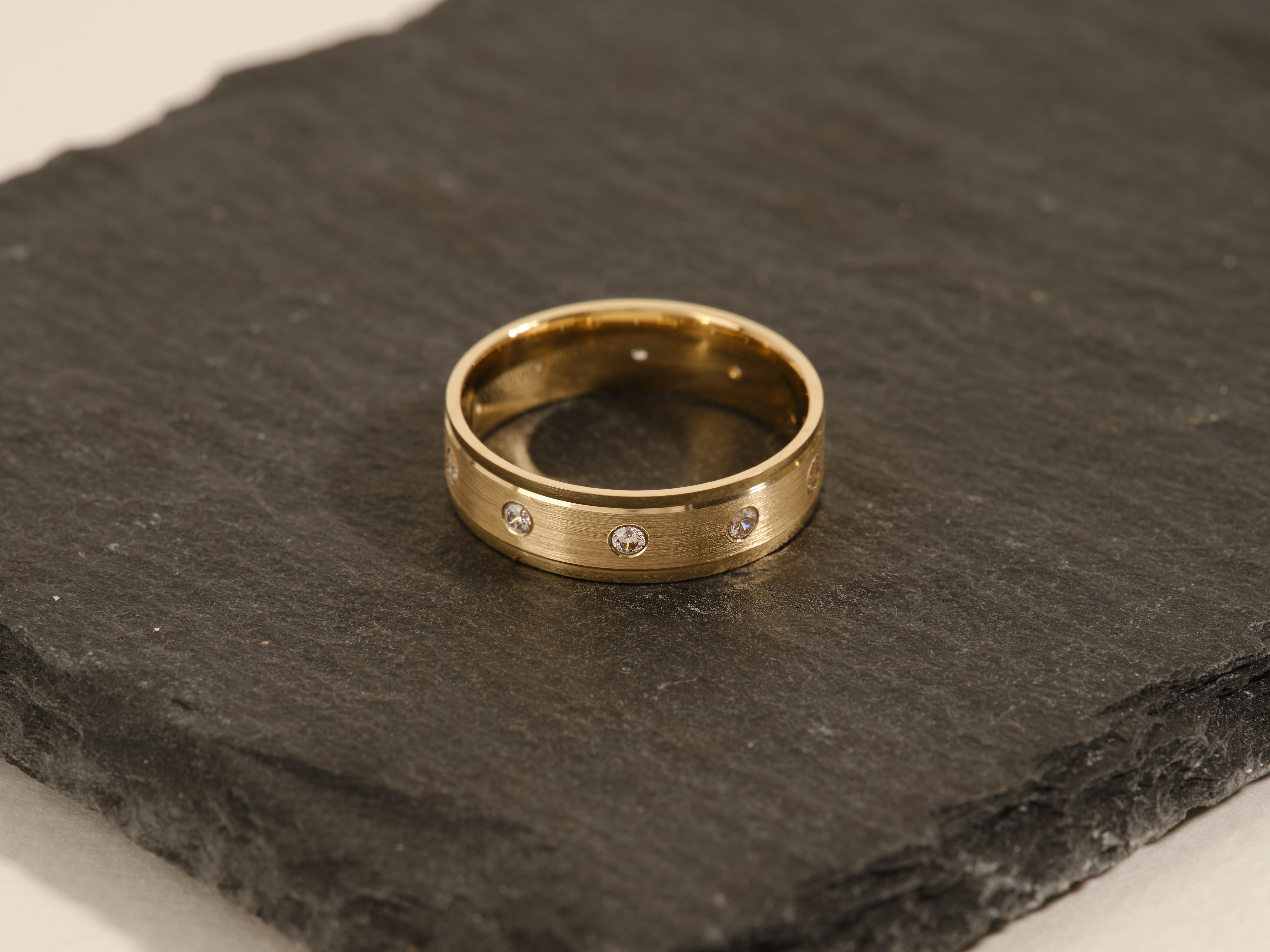 Gold ring with diamonds on slate, jewelry for sale