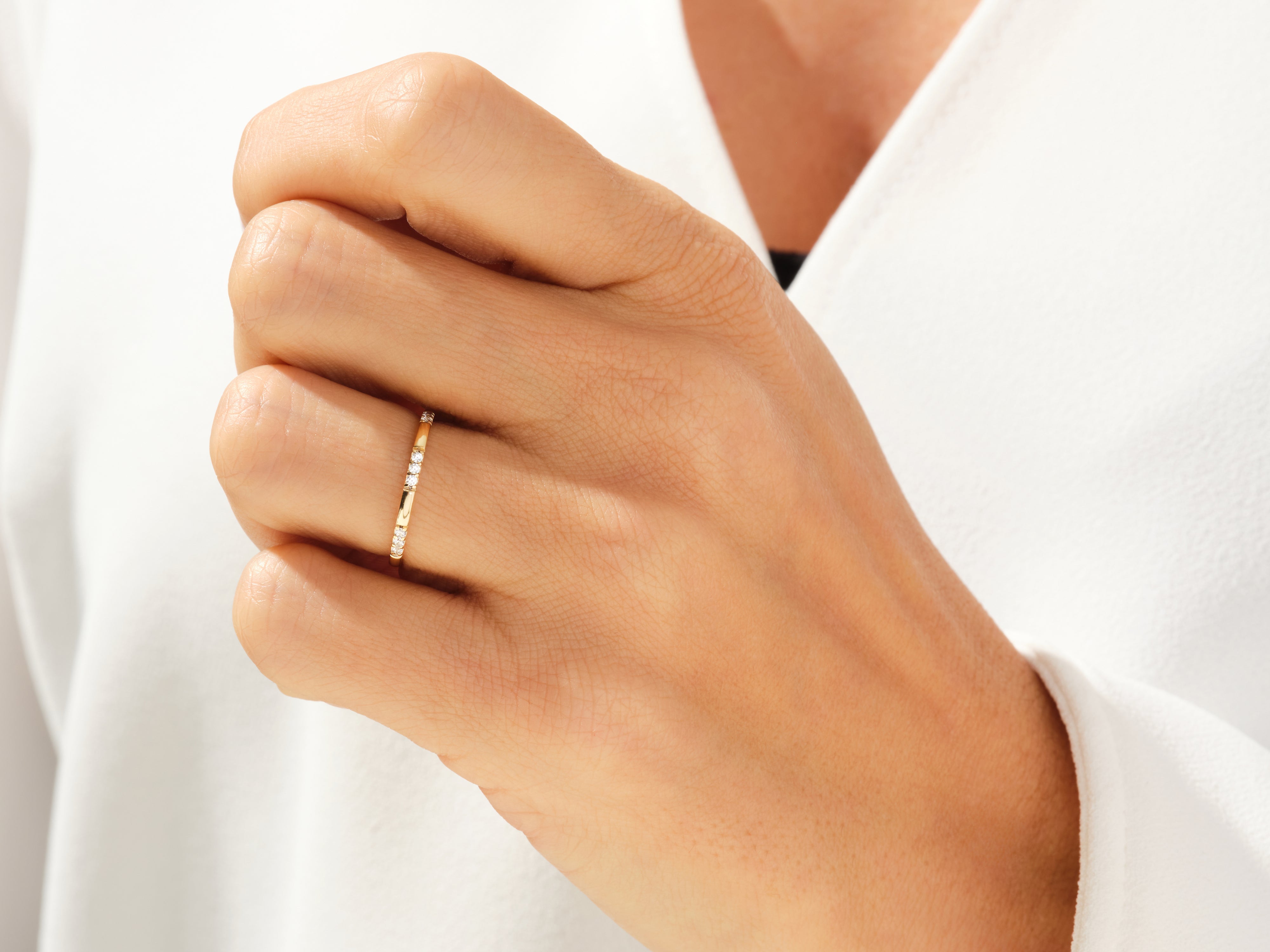 Gold diamond band ring on hand, fine jewelry