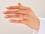 Diamond eternity ring on a woman's hand, fine jewelry
