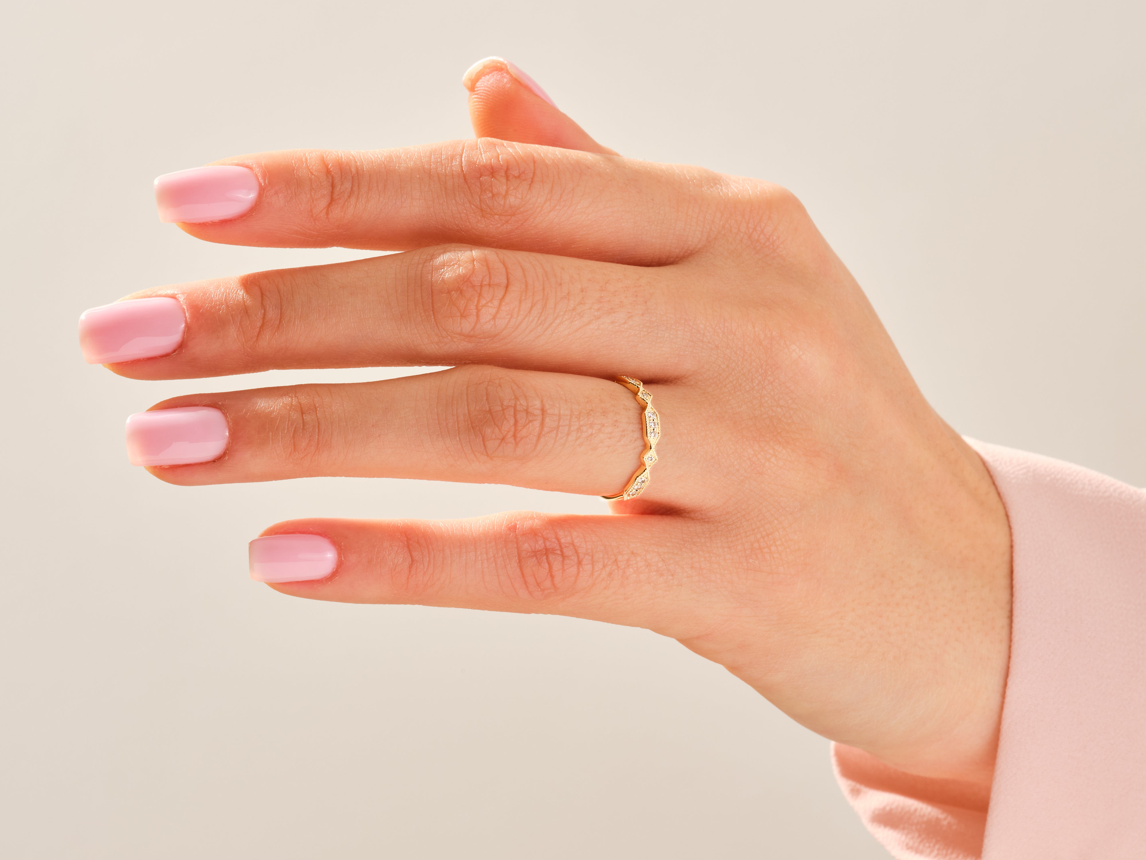Diamond and gold ring on a hand, jewelry