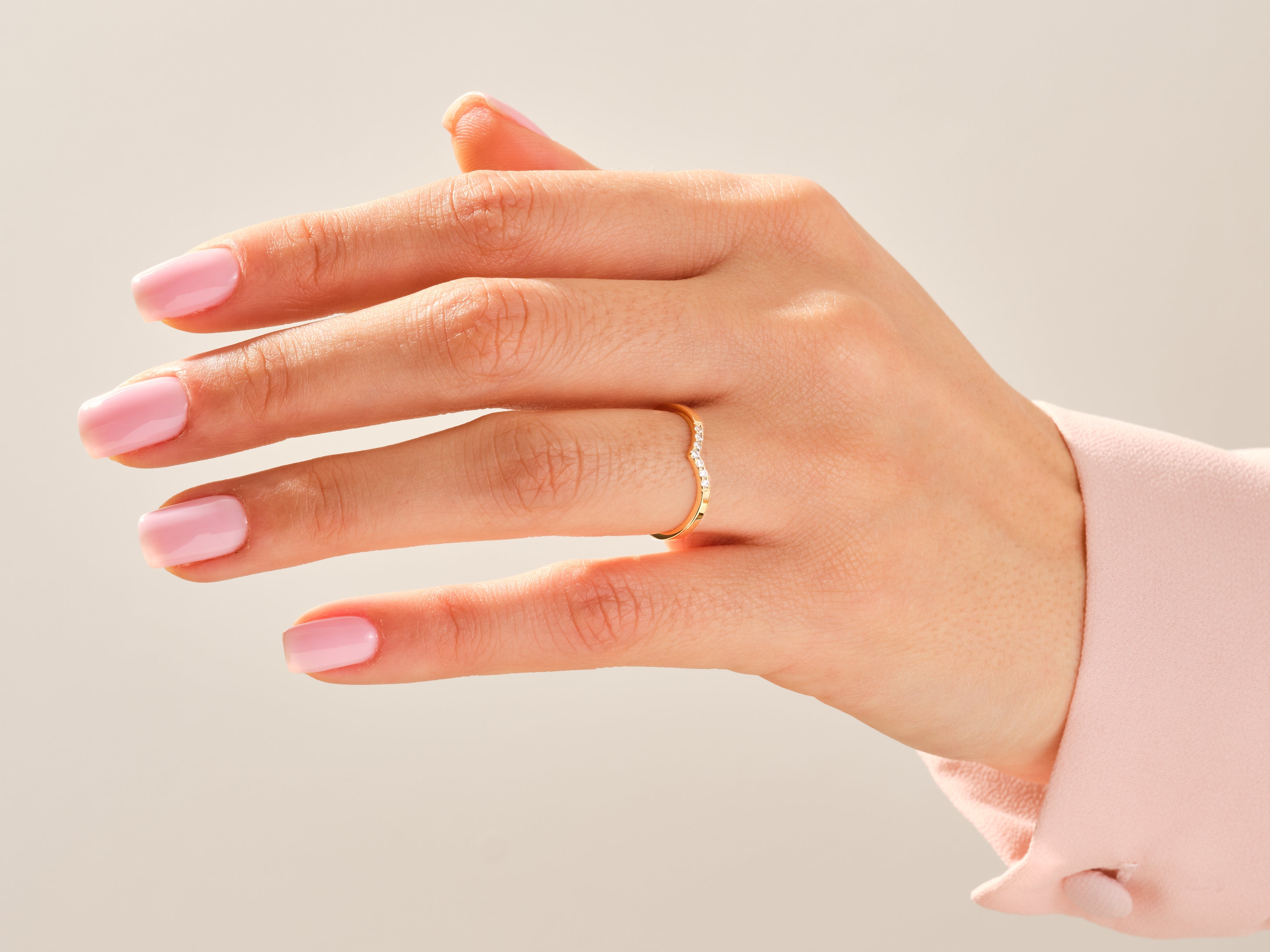 Gold diamond ring on a hand, jewelry product photography