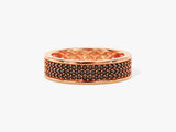 Rose gold ring with black diamonds and intricate lattice design