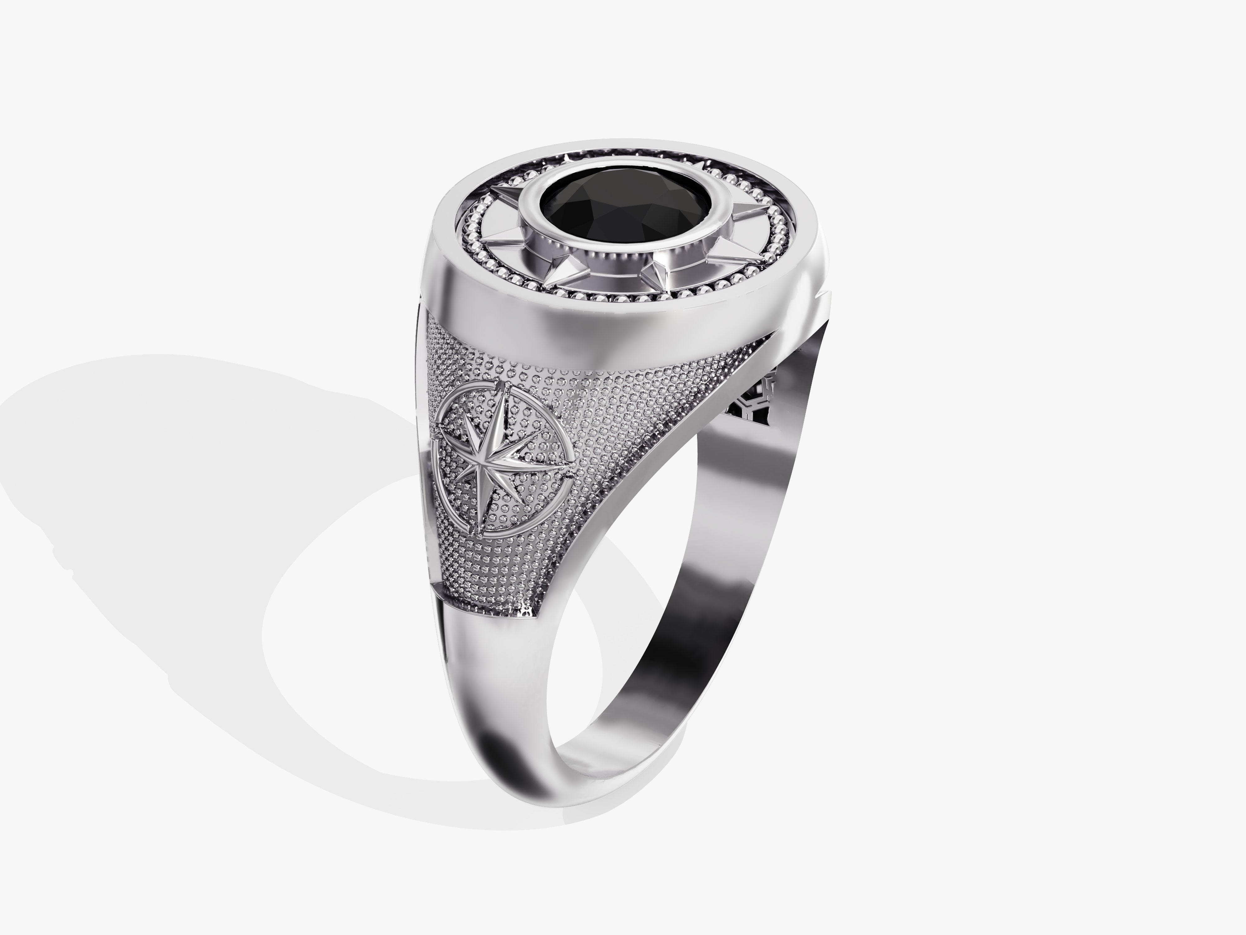 Silver compass ring with black gemstone and intricate detailing