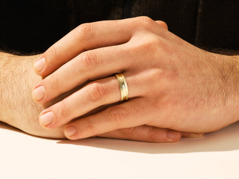 Men's textured gold wedding band on hand, jewelry for him